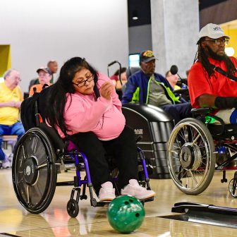 Woman in a wheelchair bowling