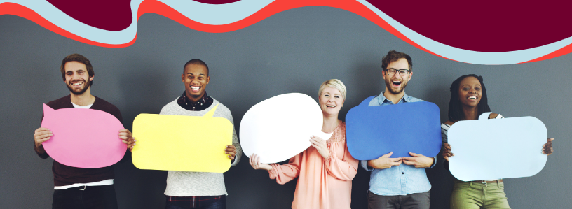 A diverse group of people holding signs shaped like speech bubbles
