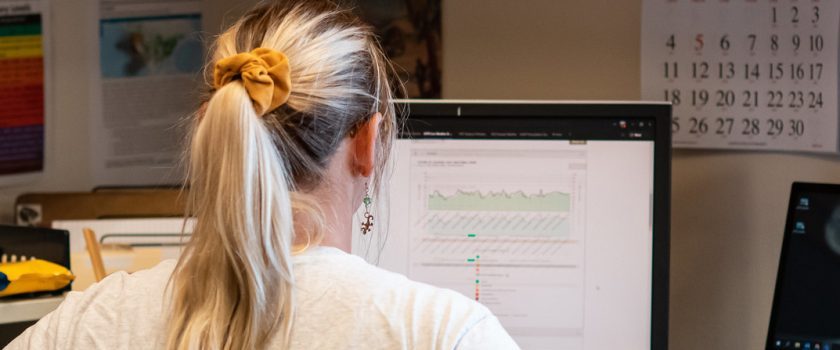 Person looking at a data graph on a computer screen